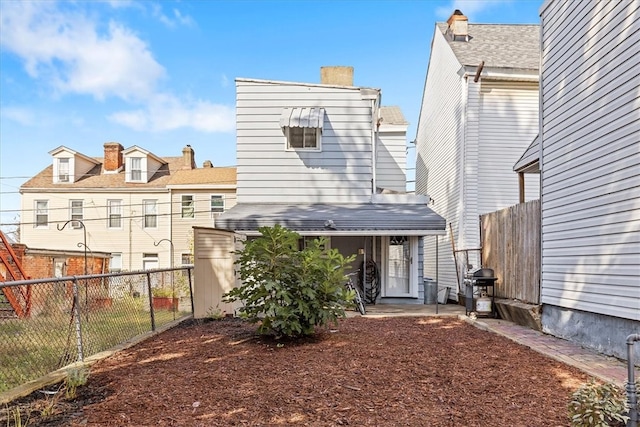 back of house featuring a patio area