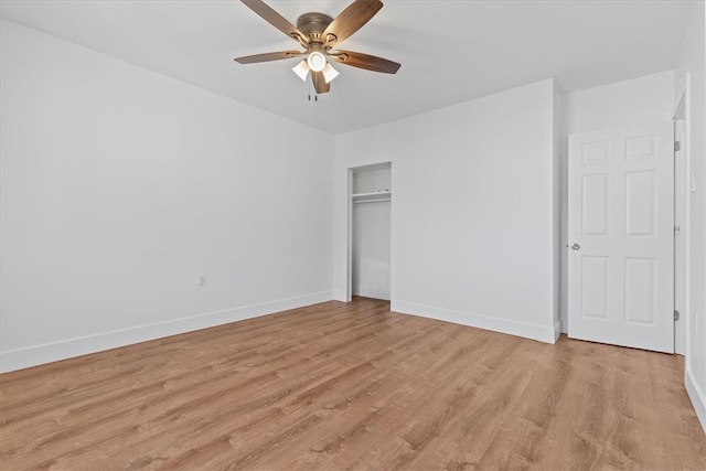 unfurnished bedroom featuring light hardwood / wood-style floors, a closet, and ceiling fan