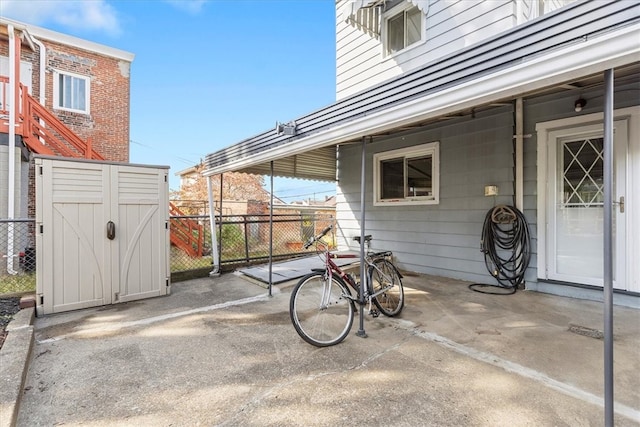 view of patio / terrace with a storage unit