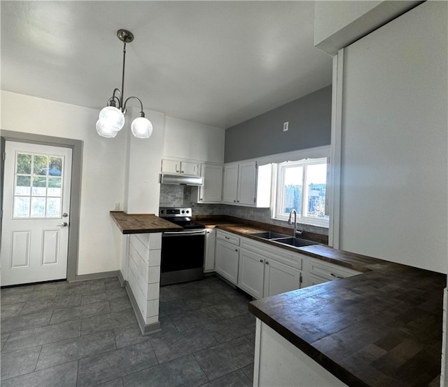 kitchen featuring stainless steel electric range, white cabinets, hanging light fixtures, butcher block counters, and sink