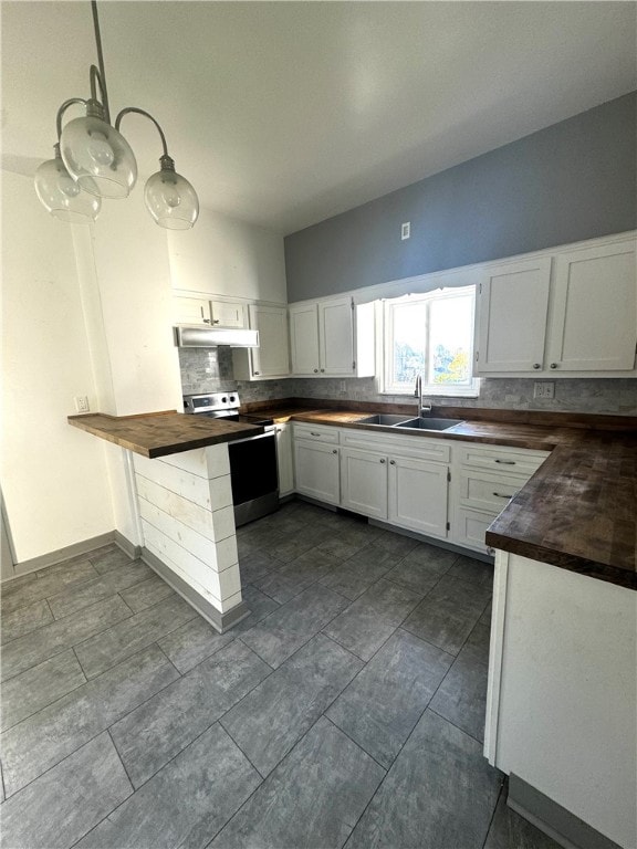 kitchen with sink, butcher block countertops, electric range, white cabinets, and decorative backsplash