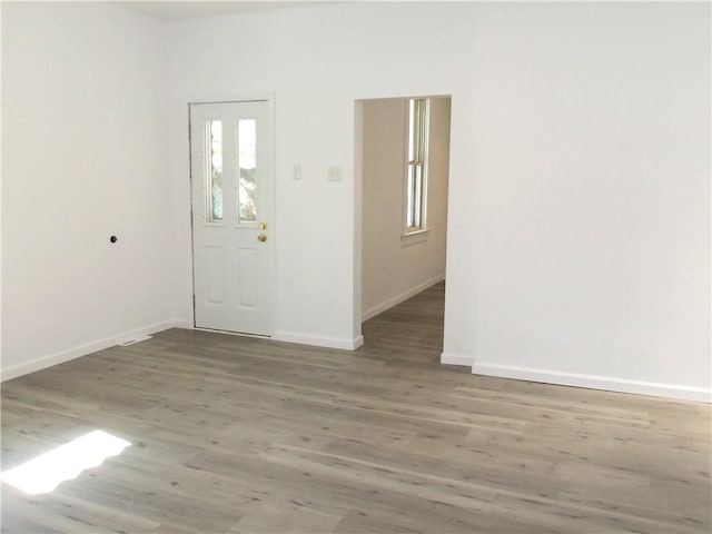 foyer with dark hardwood / wood-style flooring