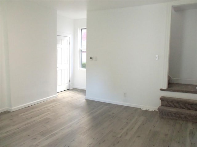 spare room featuring hardwood / wood-style floors