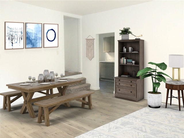 dining space featuring light wood-type flooring