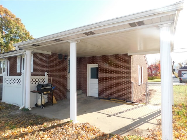 view of patio / terrace featuring area for grilling and a carport