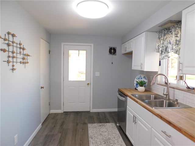 kitchen featuring sink, white cabinetry, and wood counters