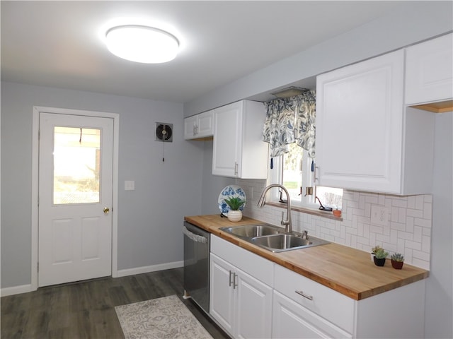 kitchen featuring butcher block countertops, dishwasher, sink, and white cabinets