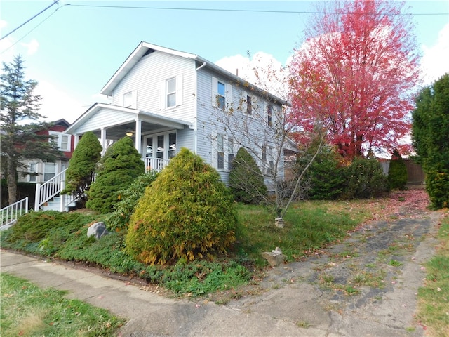 view of home's exterior featuring covered porch