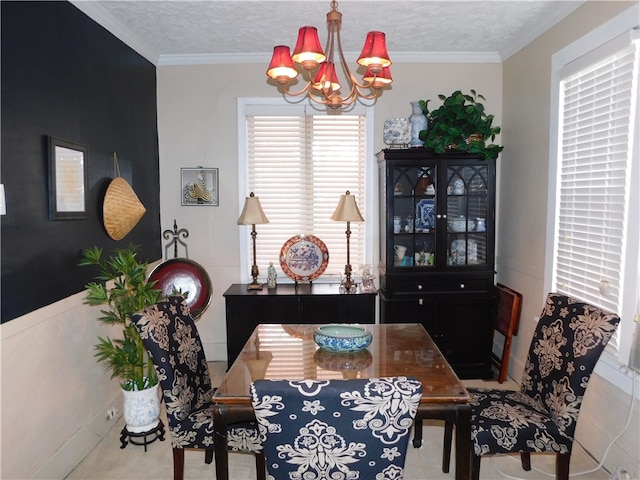 dining room featuring crown molding, a textured ceiling, and a chandelier