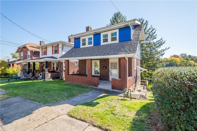 view of front of house featuring covered porch and a front lawn