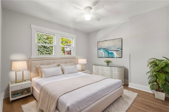 bedroom featuring ceiling fan and hardwood / wood-style flooring