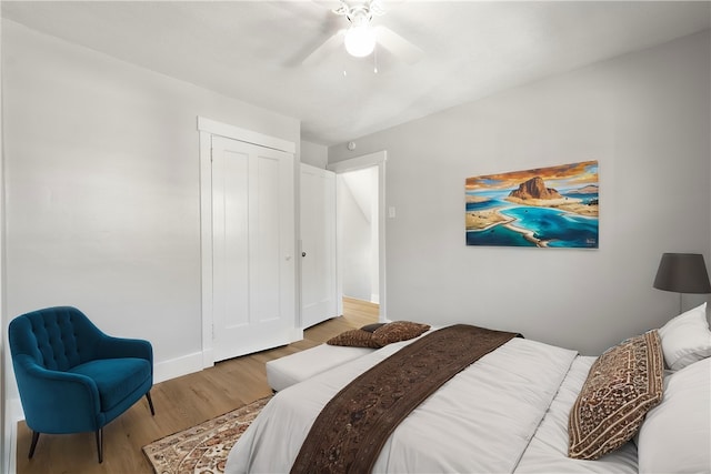 bedroom with a closet, ceiling fan, and hardwood / wood-style floors