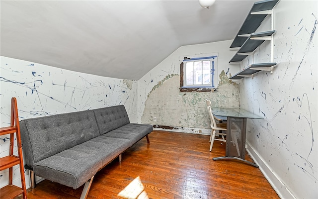 unfurnished room with dark wood-type flooring and vaulted ceiling