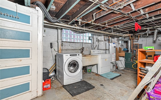 basement featuring separate washer and dryer and water heater