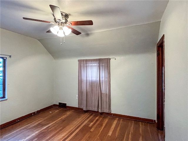 bonus room featuring dark hardwood / wood-style floors, ceiling fan, and vaulted ceiling