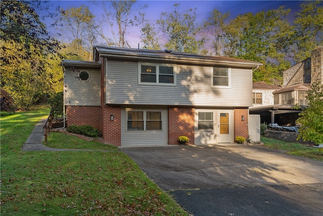 view of front of house with a yard