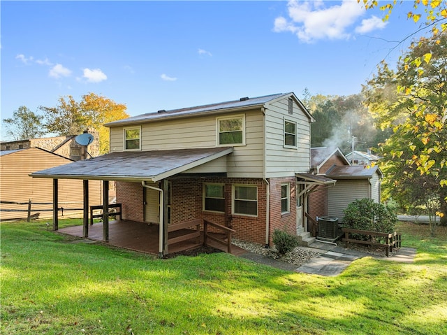 back of property featuring a patio area, cooling unit, and a lawn