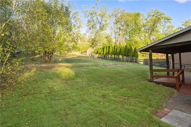 view of yard with a wooden deck