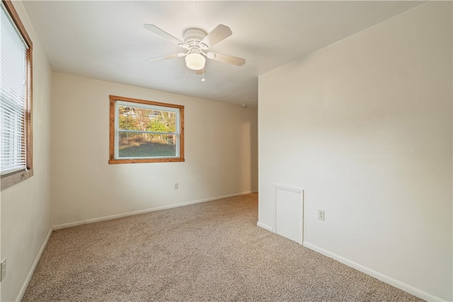 unfurnished room with carpet and ceiling fan