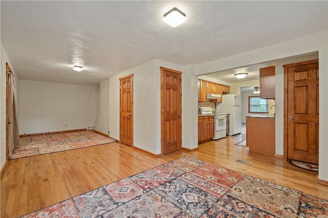 unfurnished living room featuring light hardwood / wood-style flooring