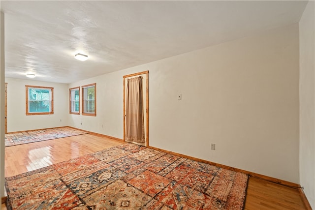 spare room with light hardwood / wood-style floors