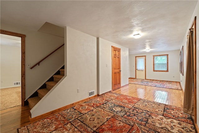 unfurnished room with wood-type flooring