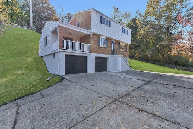 view of home's exterior featuring a yard and a garage