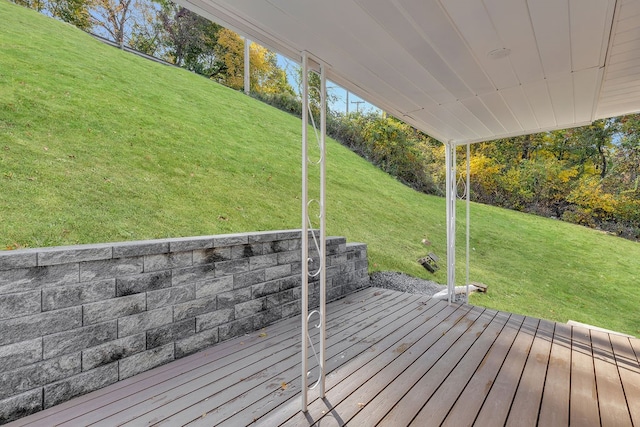 wooden deck featuring a lawn