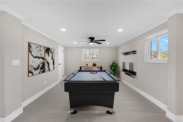 playroom with light carpet, crown molding, and plenty of natural light