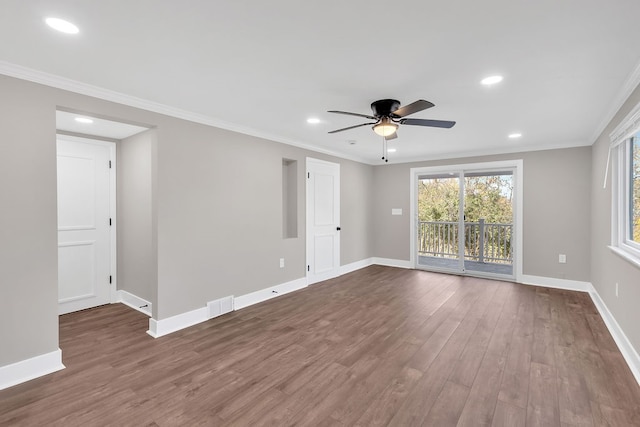 empty room with ornamental molding, hardwood / wood-style flooring, and ceiling fan