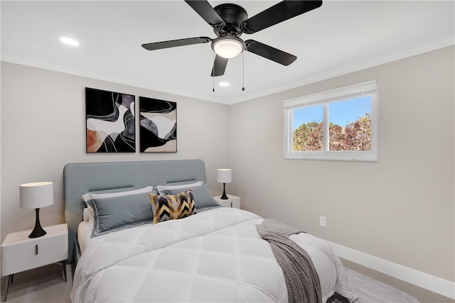 bedroom featuring ornamental molding, carpet, and ceiling fan