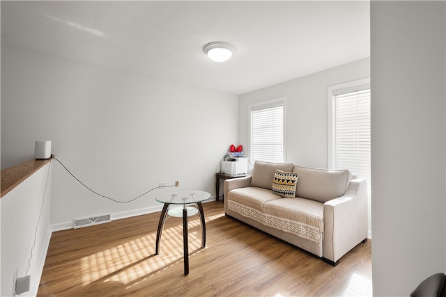 sitting room featuring wood-type flooring