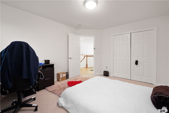 carpeted bedroom with a closet