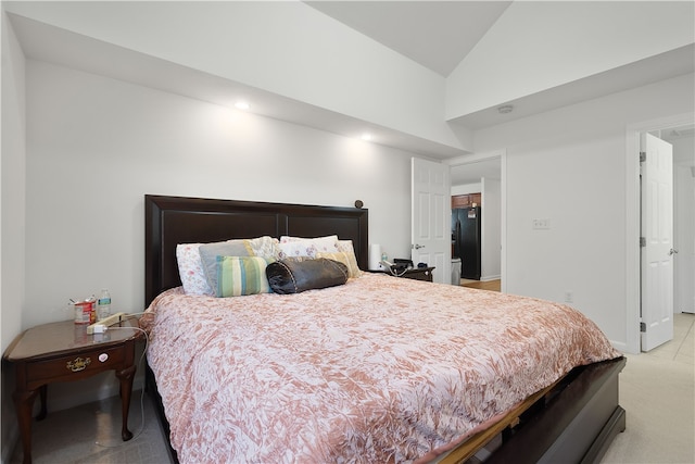 carpeted bedroom featuring vaulted ceiling