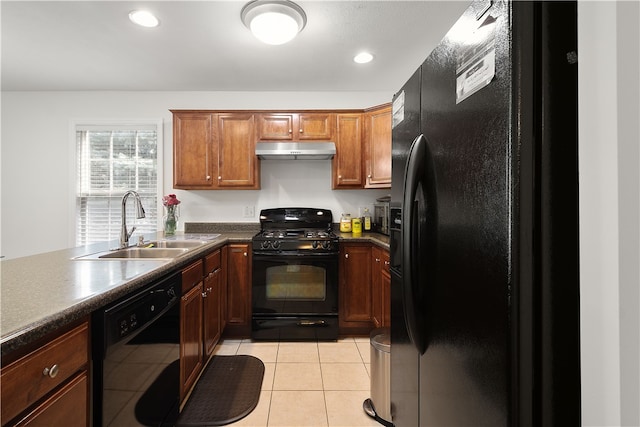 kitchen with light tile patterned floors, sink, and black appliances