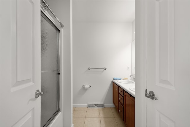 bathroom featuring tile patterned flooring and vanity