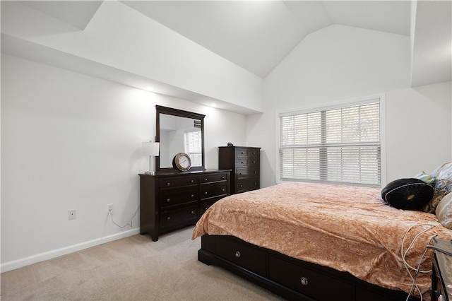 bedroom with light carpet and vaulted ceiling