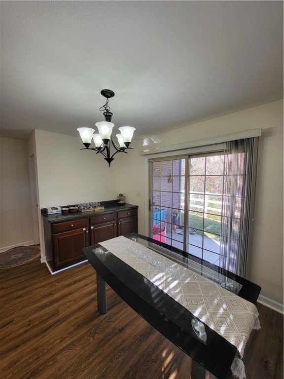 rec room with dark hardwood / wood-style flooring and a notable chandelier