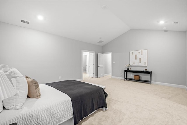 carpeted bedroom with vaulted ceiling