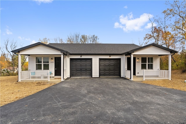 ranch-style home featuring covered porch and a garage