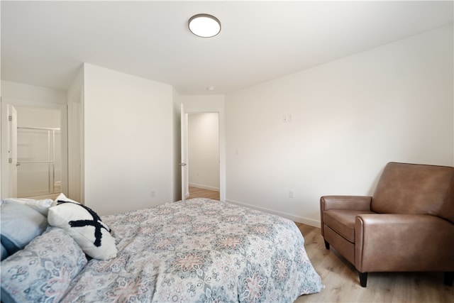 bedroom with light wood-type flooring