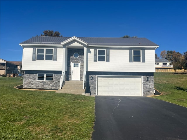 split foyer home with a front lawn and a garage