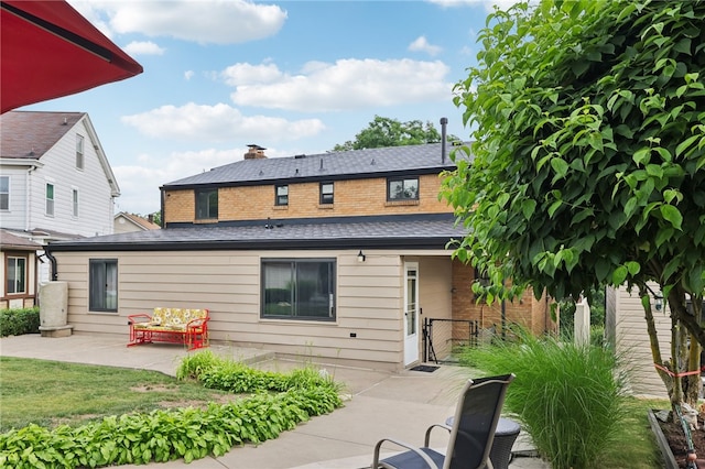 rear view of property featuring a patio