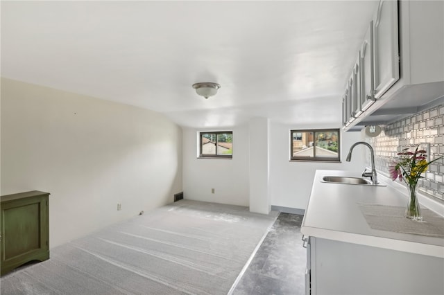 laundry room featuring sink and plenty of natural light