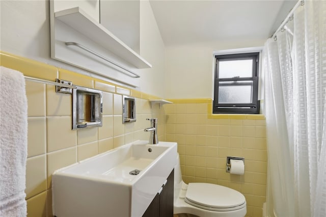 bathroom with vanity, tile walls, a shower with curtain, and toilet