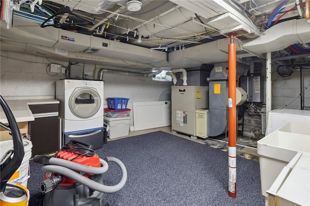 basement featuring washer and dryer and sink