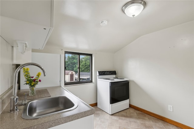 kitchen featuring lofted ceiling, sink, and electric range