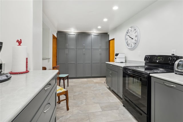 kitchen with gray cabinets and black electric range oven