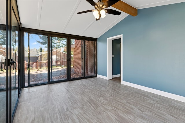 empty room featuring crown molding, vaulted ceiling with beams, wood-type flooring, and ceiling fan