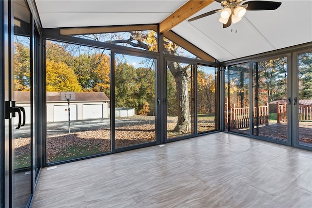 unfurnished sunroom featuring lofted ceiling with beams and ceiling fan